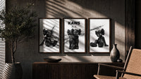 KAWS x Nike Blackout Poster Set of 3 in walnut frames above a sideboard in a warm room