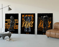KAWS Signature Orange Edition three-panel set displayed beside a brown leather sofa
