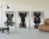 KAWS Companion Graffiti Triptych displayed beside a brown leather sofa