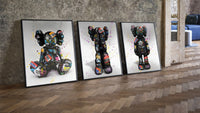 KAWS Companion Graffiti Triptych leaning on parquet beside a vintage loft door