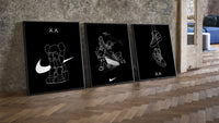 KAWS Companion x Nike Swoosh Sketch Triptych leaning on parquet beside a vintage loft door