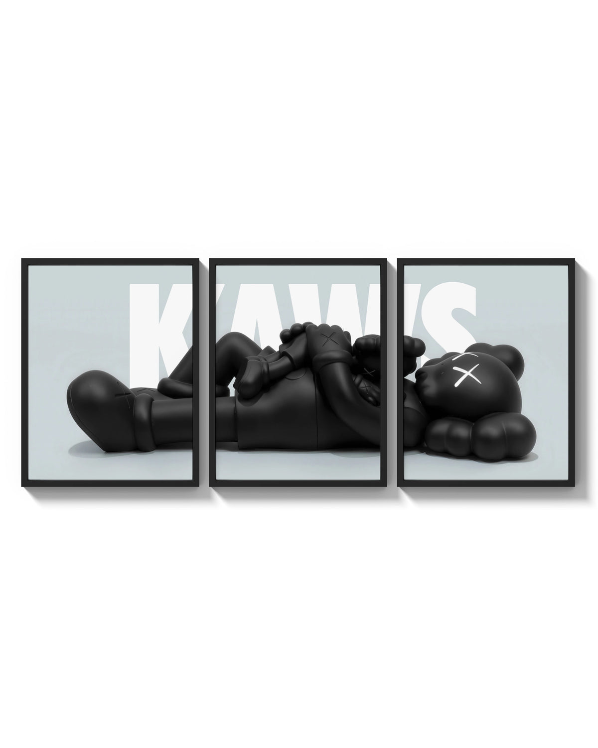 KAWS Reclining Companion Triptych arranged on a bright gallery wall