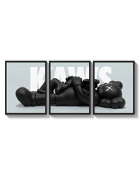 KAWS Reclining Companion Triptych arranged on a bright gallery wall