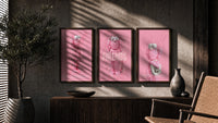 Pink Cotton Candy KAWS Friends Trio in walnut frames above a sideboard in a warm room