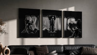 KAWS Neon Companions Triptych in black frames on a grey wall above a leather sofa