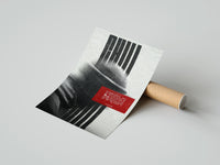 Rolled figure in helmet obscured by stripes poster beside its crush-resistant kraft shipping tube