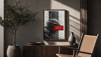 figure in helmet obscured by stripes poster framed above a fluted sideboard beside an olive tree