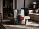 figure in helmet obscured by stripes print in a black frame leaning on a travertine table in a sunlit lounge