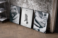 Nike Air Force 1 Poster Set set of three black-framed prints leaning against a raw-plaster wall
