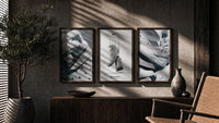 Nike Air Force 1 Poster Set triptych in three walnut frames above a sideboard in a warm room