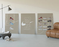 Off-White Nike Poster Set three-panel set displayed beside a brown leather sofa
