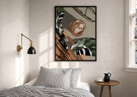 Iced Coffee Flat Lay print in a black frame above a bed with striped linens, a brass wall lamp and a sunlit window