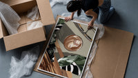 Iced Coffee Flat Lay framed print being unpacked from protective bubble wrap and a box
