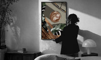 Iced Coffee Flat Lay print in a slim black frame being hung on a sunlit wall in a monochrome room