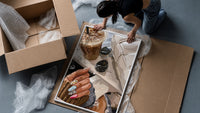 Iced Coffee with Sunglasses and Handbag framed print being unpacked from protective bubble wrap and a box