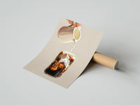 Gently curled Iced Latte Cream Pour print beside its protective shipping tube