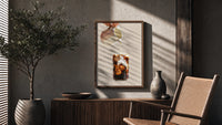 Iced Latte Cream Pour poster framed above a fluted sideboard beside a potted tree