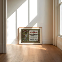 Art Nouveau women with roses print in an oak frame on a sunlit wood floor beneath tall window light
