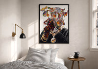 Iridescent Flowers Over the Face print in a black frame above a bed with striped linens