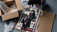 Itachi Uchiha anime character framed print being unpacked from protective bubble wrap and a box