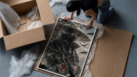 anime ninja with red eyes framed print being unpacked from protective bubble wrap and a box