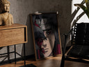 Walnut-framed Anime ninja with red Sharingan eye print leaning against a sunlit rustic brick wall