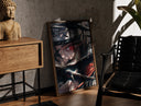 Walnut-framed Anime ninja with Sharingan eye print leaning against a sunlit rustic brick wall