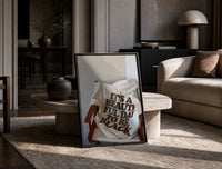 It's a Beautiful Day to Be Black print on the floor, leaning against a travertine table