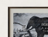 Close-up of the Large elephant with tusks print's dark wood frame corner and archival matte paper