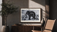 Large elephant with tusks print in a wood frame above a fluted sideboard beside an olive tree