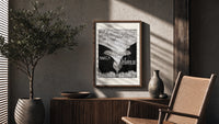 Baby cherub sitting on flower poster framed above a fluted sideboard beside an olive tree