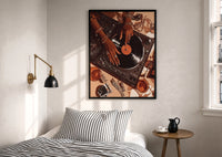 Jeweled Hands on a Record Player print in a black frame above a bed with striped linens