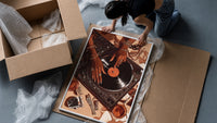 Jeweled Hands on a Record Player framed print being unpacked from protective bubble wrap and a box