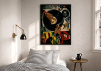 Jeweled Hands on a Turntable print in a black frame above a bed with striped linens, a brass wall lamp and a sunlit window