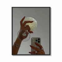 Framed Jeweled Hands with Phone and Glass print shown as a bold statement piece on a clean gallery wall
