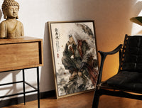 Brass-framed White-haired ninja sitting thoughtfully print leaning in a warm styled corner by a sculpture
