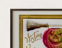 Close-up of the Carved jack-o-lantern hanging on broom print's dark wood frame corner and archival matte paper