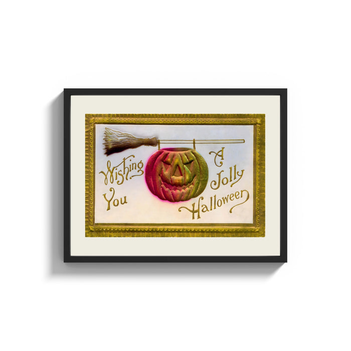 Framed Carved jack-o-lantern hanging on broom print shown as a wide statement piece on a clean white wall