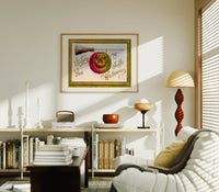 Carved jack-o-lantern hanging on broom print in an oak frame above a mid-century book console with a vintage radio
