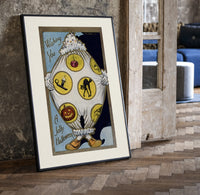 Vintage Halloween clown holding sheet print in a black frame leaning beside a vintage door on parquet