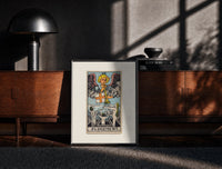 Black-framed Angel blowing trumpet over rising figures print on a moody console with designer coffee-table books