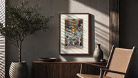 Angel blowing trumpet over rising figures poster framed above a fluted sideboard beside an olive tree