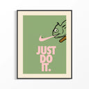 Just Do It Chameleon Green Pink poster in black frame showing cartoon chameleon with pink Nike swoosh on sage green.