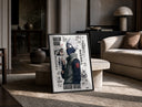 Kakashi Hatake ninja character print in a black frame leaning on a travertine table in a sunlit lounge
