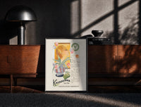 Black-framed Woman smelling tulips in vase print on a moody console with designer coffee-table books