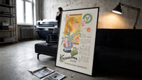 Woman smelling tulips in vase print in a slim black frame leaning on a dark sofa in a concrete print studio