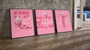 KAWS BFF figure trio three-piece set leaning on parquet beside a vintage loft door