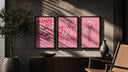 KAWS BFF figure trio triptych in three walnut frames above a sideboard in a warm room