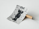 A panel of the KAWS Companion figure set rolled beside its kraft shipping tube