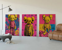 KAWS Companion figures triptych three-panel set displayed beside a brown leather sofa